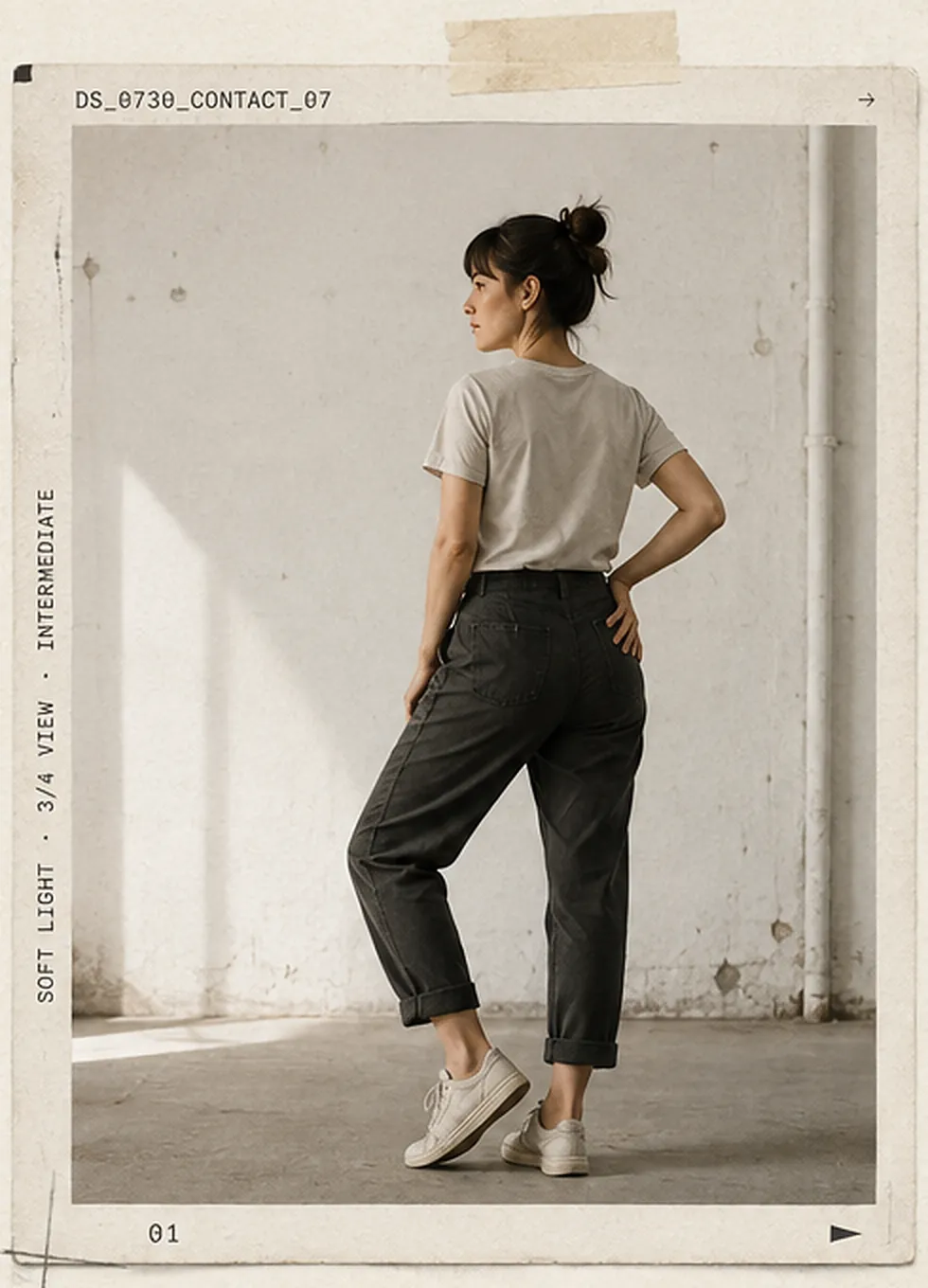 Today's reference, DS_0730_CONTACT_07: a figure standing with weight on one leg, three-quarter back view in soft light.